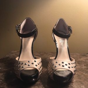 Black patent leather and tan studded heel